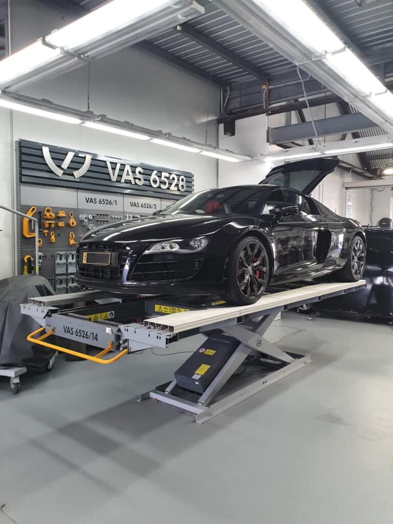 Vehicle in a smash repair workshop during the restoration process.